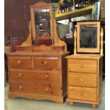 A Victorian style pine dressing chest of two long and two short drawers with raised mirror over,