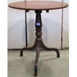 A 19th century mahogany occasional table, the oval top raised on a vase shaped pillar and tripod,