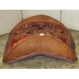 A traditional leather and material covered camel seat