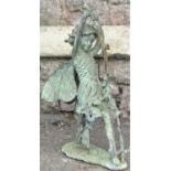 A weathered cast metal (probably bronze) ornament in the form of a fairy pulling or bending back a