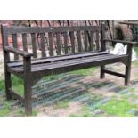 A stained teak three seat garden bench with slatted seat and back, probably Lister (af) 158cm wide