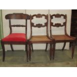 A selection of Regency mahogany chairs including an elbow chair with scrolled arms and sabre legs,