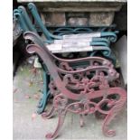 Two pairs of cast iron bench ends, with scrolled arms and supports, together with a matching pair of