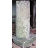 A weathered natural stone cylindrical column/pedestal with combined square cut base (AF) 68 cm high
