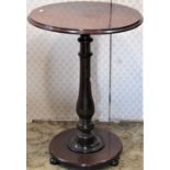 A 19th century mahogany occasional table, the circular top on a vase shaped column and disc base