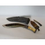 A Kukri within leather sheath, 41cm long