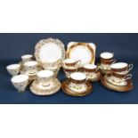 A collection of Royal Stafford teawares in a red and gilt colourway comprising cake plate, milk jug,