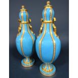 A pair of good quality 19th century turquoise ground vases and covers in the Minton manner with