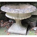 A reclaimed campana shaped garden urn, the squat circular lobed bowl with flared egg and dart rim,