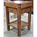 A stained pine butchers block and combined stand fitted with a frieze drawer, with slatted under