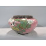 Japanese cloisonné baluster jardinière decorated with birds and foliage upon a pink ground, 31cm