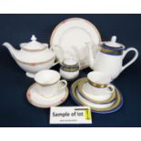 A collection of Royal Doulton Darjeeling pattern wares comprising an oval meat plate, oval serving
