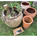 Six terracotta planters of various sizes