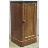 A Victorian mahogany pot cupboard with panelled door, set beneath a marbled top