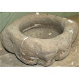 An antique stone mortar with shaped lugs (AF), 36 cm in diameter at widest point z 14 cm high (AF)