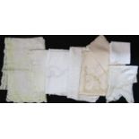 Suitcase full of good quality white vintage table cloths including 4 large white cloths with crochet