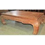 A contemporary low Chinese hardwood Opium type table with rectangular top, moulded frieze and