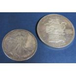 Mexican 2 oz 999 silver 500 anos coin together with a further 1987 American silver dollar, 3 oz