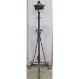 A Victorian ironwork telescopic lamp standard bearing the original copper reservoir