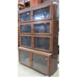 A four tier sectional bookcase with hinged glazed doors, 89cm wide (lacks plinth)