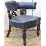 A Victorian mahogany library chair with carved and pierced detail, horseshoe shaped back and