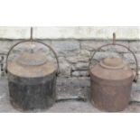 Two similar heavy cast iron inglenook fireplace kettles with domed lids, loop handles with hook