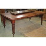 A Victorian mahogany wideout extending dining table of rectangular form, with moulded outline,