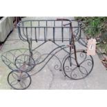 A small novelty light steel and wirework garden planter in the form of a tricycle, together with a