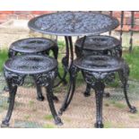A small cast aluminium garden terrace table with decorative pierced scrolling acanthus circular top,