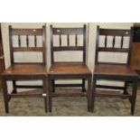 Three Georgian countrymade spindle back dining chairs, on square tapered supports