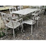 A weathered cream painted, cast aluminium garden terrace table of rectangular form with decorative