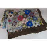 Vintage traditional patchwork quilt with multi coloured hand stitched hexagonal 'flowers' surrounded