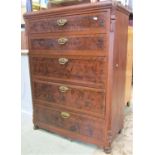 An antique continental pine chest of five long graduated drawers, with hand painted simulated walnut