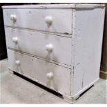 A painted pine chest of three long drawers