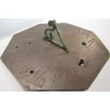 An 18th Century octagonal sundial with engraved detail signed Hedger London 20cm