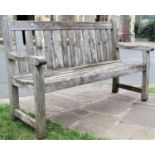 A vintage weathered teak garden bench with slatted seat and back (af) 150cm long