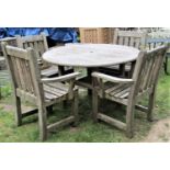 A Woodfern weathered teak garden suite comprising table with overhanging circular slatted top, set