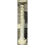 A decorative two sectional veined marble cylindrical column 116 cm high, the top 245 cm in