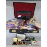 A leather briefcase containing a large collection of Masonic regalia for mainly the