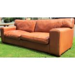 A very substantial good quality hide upholstered sofa in a light tan coloured finish, 260 cm in