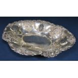 1920s silver Victorian style oval dish, the raised flared rims embossed with floral sprays and