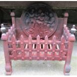A small weathered cast iron fire basket of rectangular form with trellis frieze and urn finials,