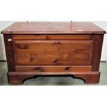 A pine blanket chest by Ducal with panelled frame and raised on castors, 87 cm in length