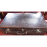 Good large vintage hide travelling trunk, the hinged lid enclosing a trayed tier and fitted