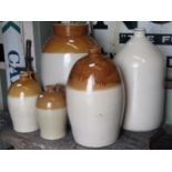 A stoneware four gallon flagon with impressed number 734 and merchants mark for N J Reed,