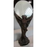 Art Nouveau style figural mirror, the circular plate held aloft by a semi nude maiden, 87 cm high