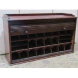 A Victorian mahogany office cabinet with shallow three quarter gallery over a rise and fall