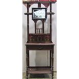 A late Victorian/Edwardian stained oak hall stand of full height, the raised back with moulded