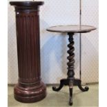 A 19th century mahogany occasional table, the circular dish shaped top raised on a spiral column