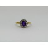 18ct amethyst and diamond oval cluster ring, size J, 2.5g (amethyst chipped)